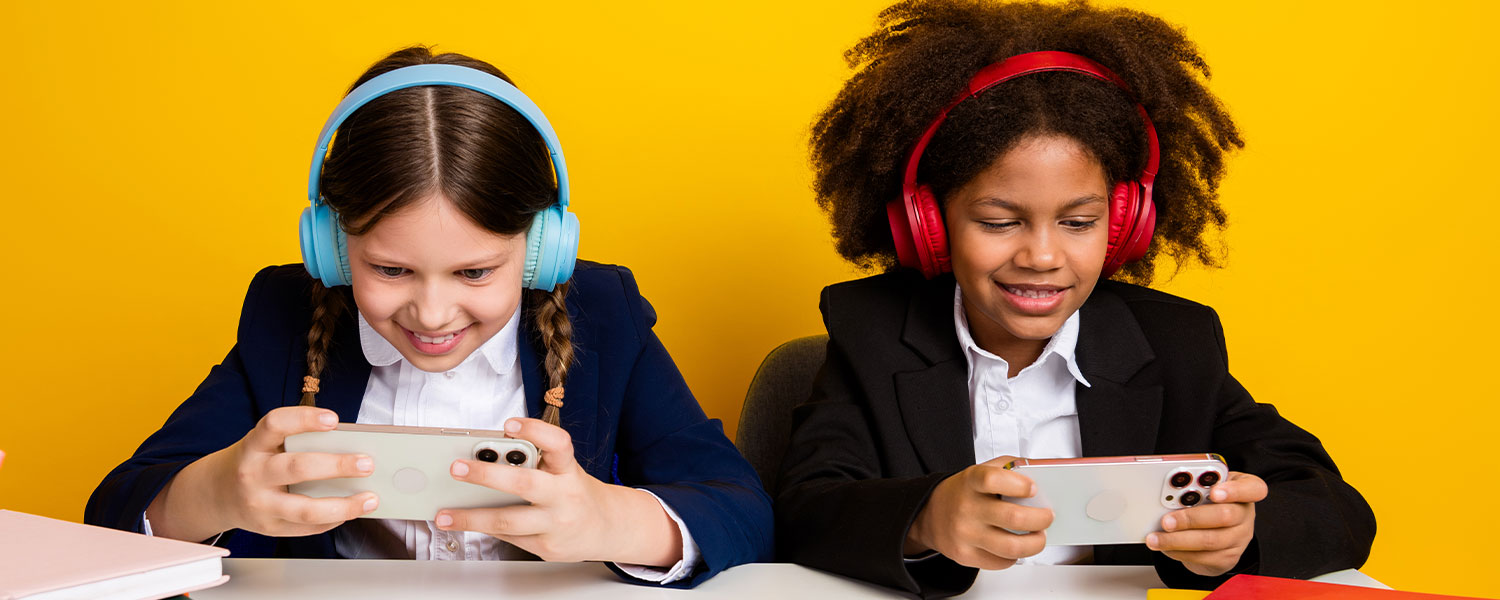 school children wearing headphones