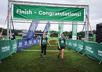 Two Mighty Hikers crossing the finish line