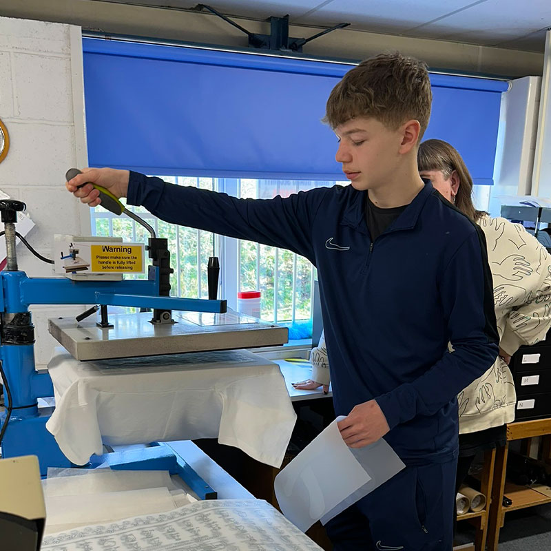 Boy using heat press